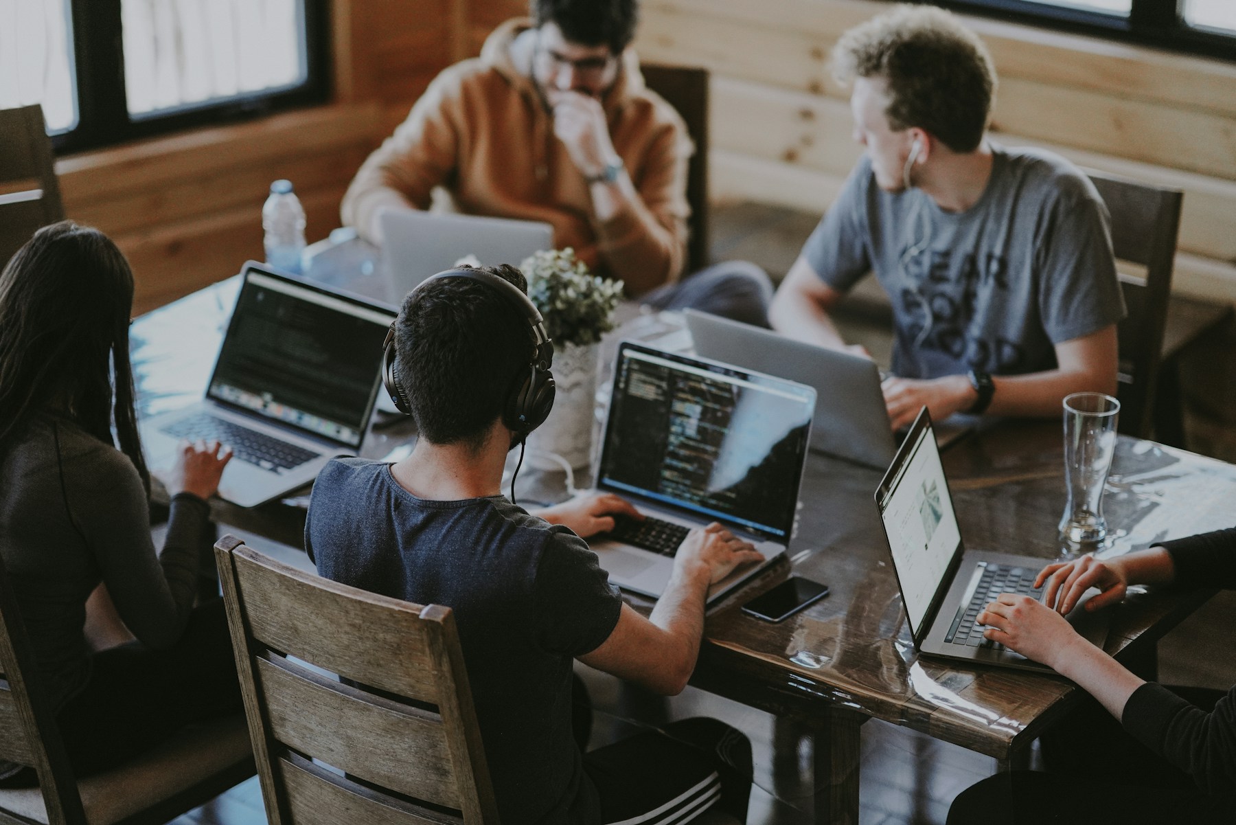 Creative professionals collaborating around a shared studio table
