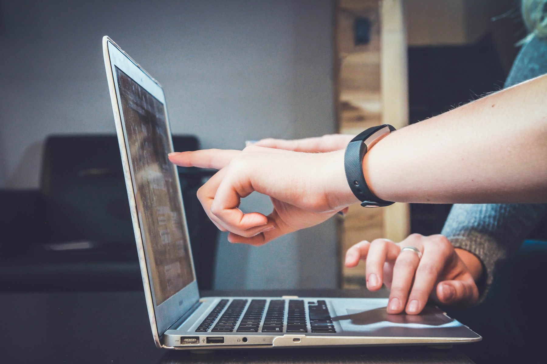 Collaborating on a website at a clean laptop workstation